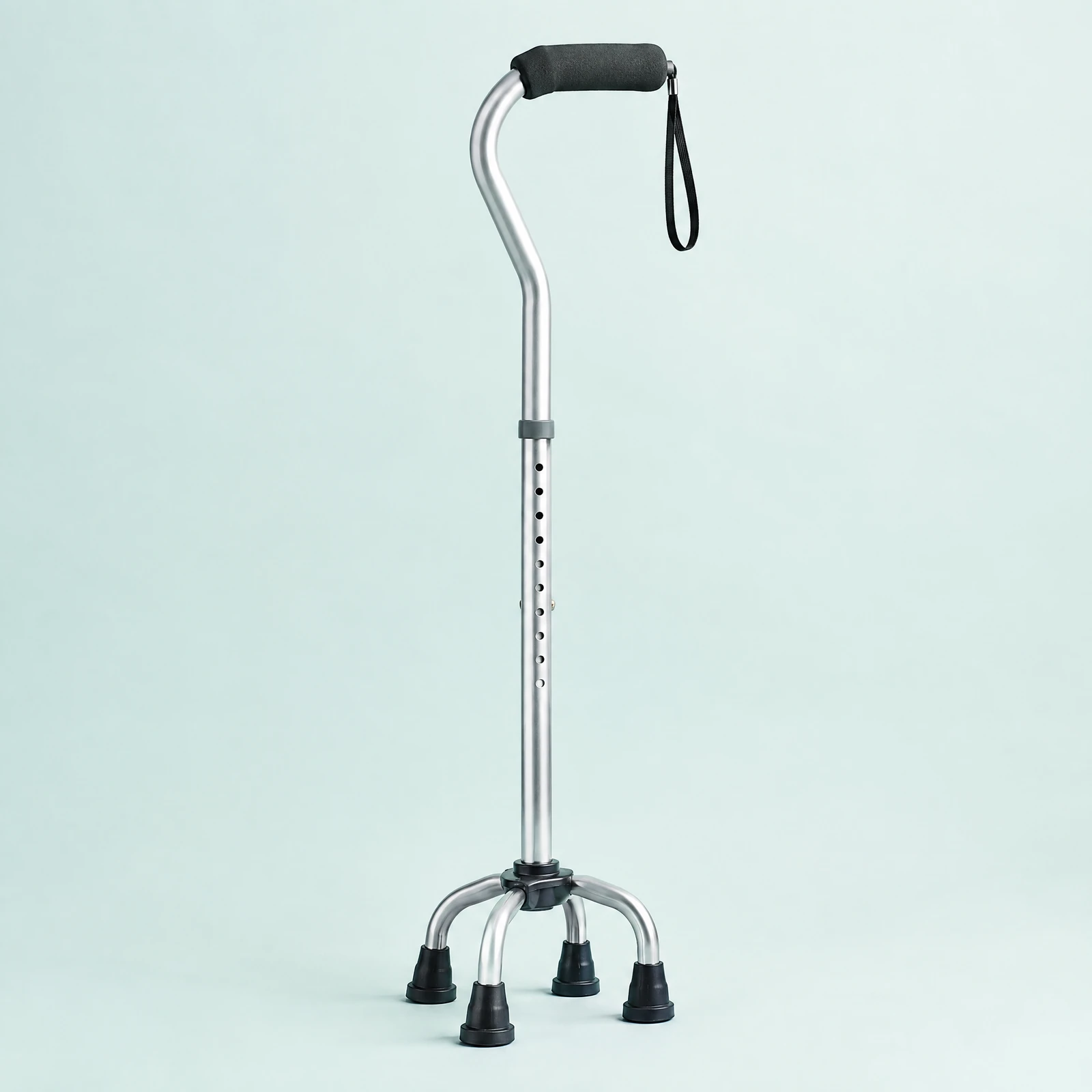 Silver-tone quad-base walking cane with padded black handle and wrist strap